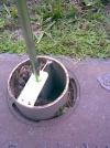 The Turf-Tec Cemetery Vase Clean Out Tool is simply inserted into a cordless drill and placed into the monument vase to be cleaned out.