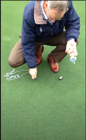 Once you remove the meter and the washer of the Precision Putting Green Firmness Compaction Meter, you use the ball mark tool to fix the indentation in the green