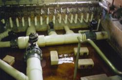 November 1999, Pro Player Stadium, Miami, FL.  Pump room for Prescription Athletic Turf (PAT) showing drain lines under turf that are connected to a vacuum pump for evacuation of water for rain events.