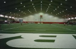 This is the indoor football practice field at the University of Alabama, in  Tuscaloosa, AL.  It is a artificial Astro play wield with long fibers filled with crumb rubber.