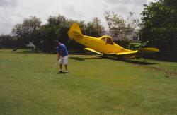 This is a banner plane that crash landed on the 10th fairway at Jacaranda Golf Club.  This golfer was adamant about playing through, despite the insistence of a police officer.  Photo was also used in my monthly article "John Mascaro's Photo Quiz in Golf Course Management (October 2003 Issue).
