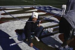 This is Terry Porch, Sports Turf Manager for the Tennessee Titans painting the center field logo for SuperBowl XXXIX at Alltel Stadium, Jacksonville, Florida.  In addition to the SuperBowl, there are hundreds of publicity events held on the field before the game is actually played.