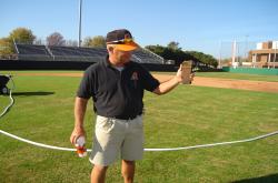 This is Bryan White, former Turf and Field Supervisor at Oklahoma State University.  He is showing his soil profile from the Baseball field.