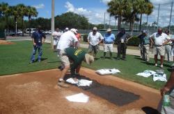 This is Bruce Bates and Kevin Hardy (formerly head groundskeeper at the University of Miami) giving a demonstration on how to properly build a batters box at the City of Palms Park.